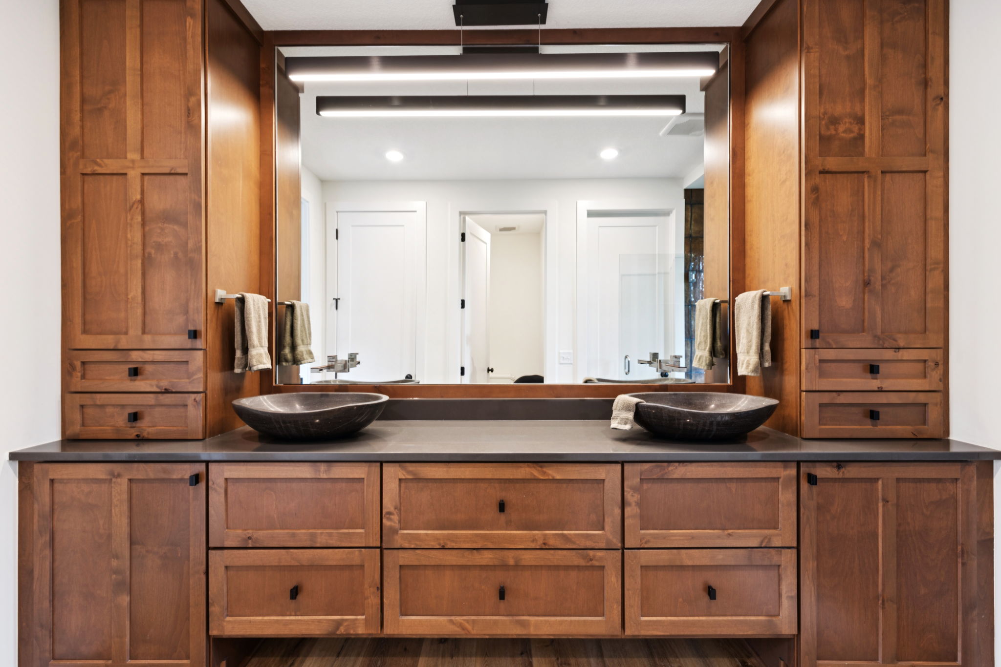 Primary bath double vanity with stone vessel sinks